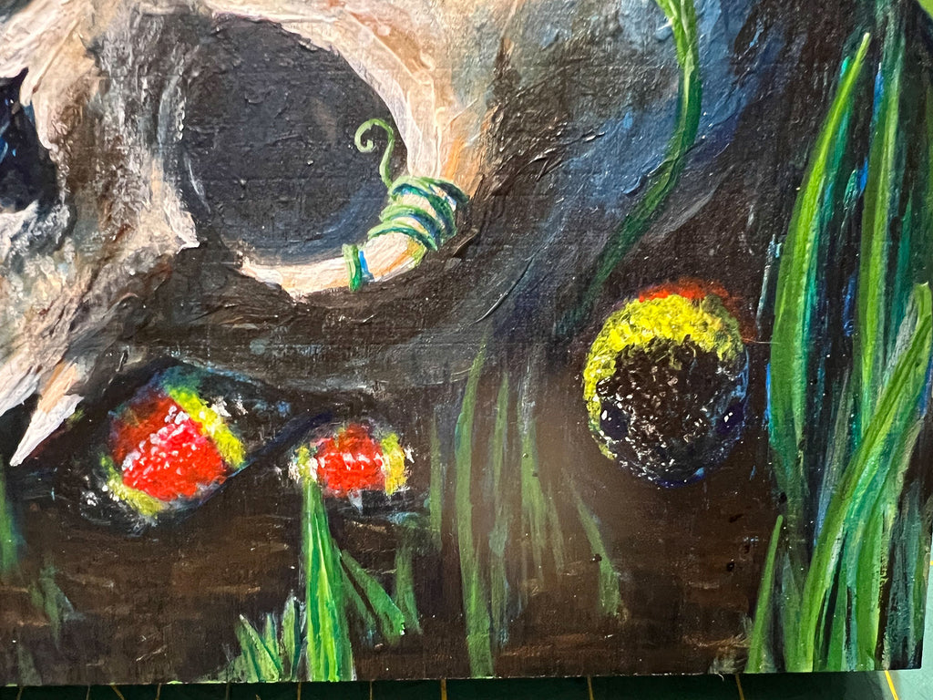 close up of coral snake hidden in painting