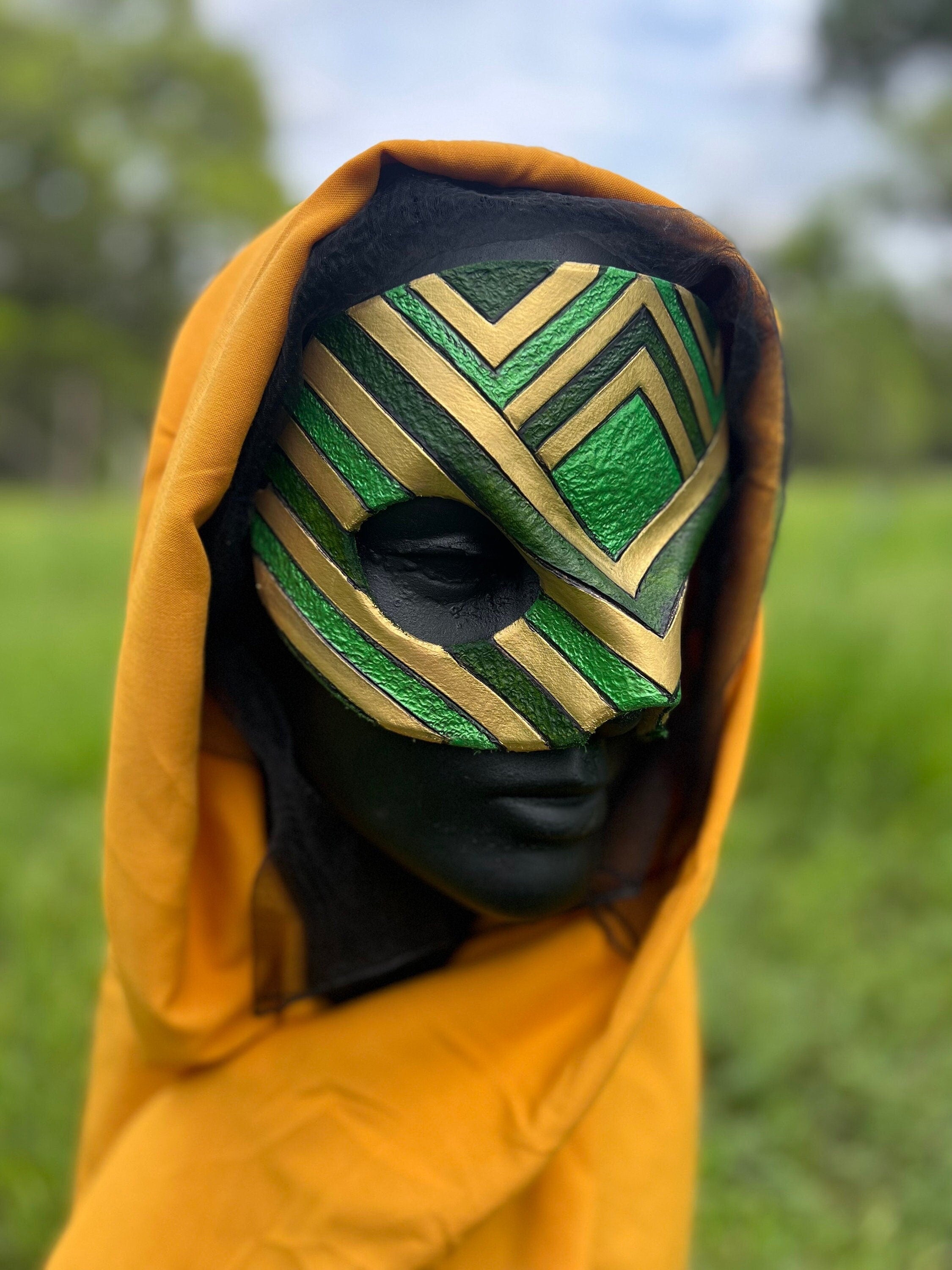 Loki Inspired Green and gold mask displayed on head