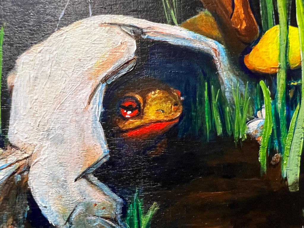 A close-up painting of a frog peeking out from a broken skull, surrounded by green grass and a yellow mushroom, with dark shadowy background.