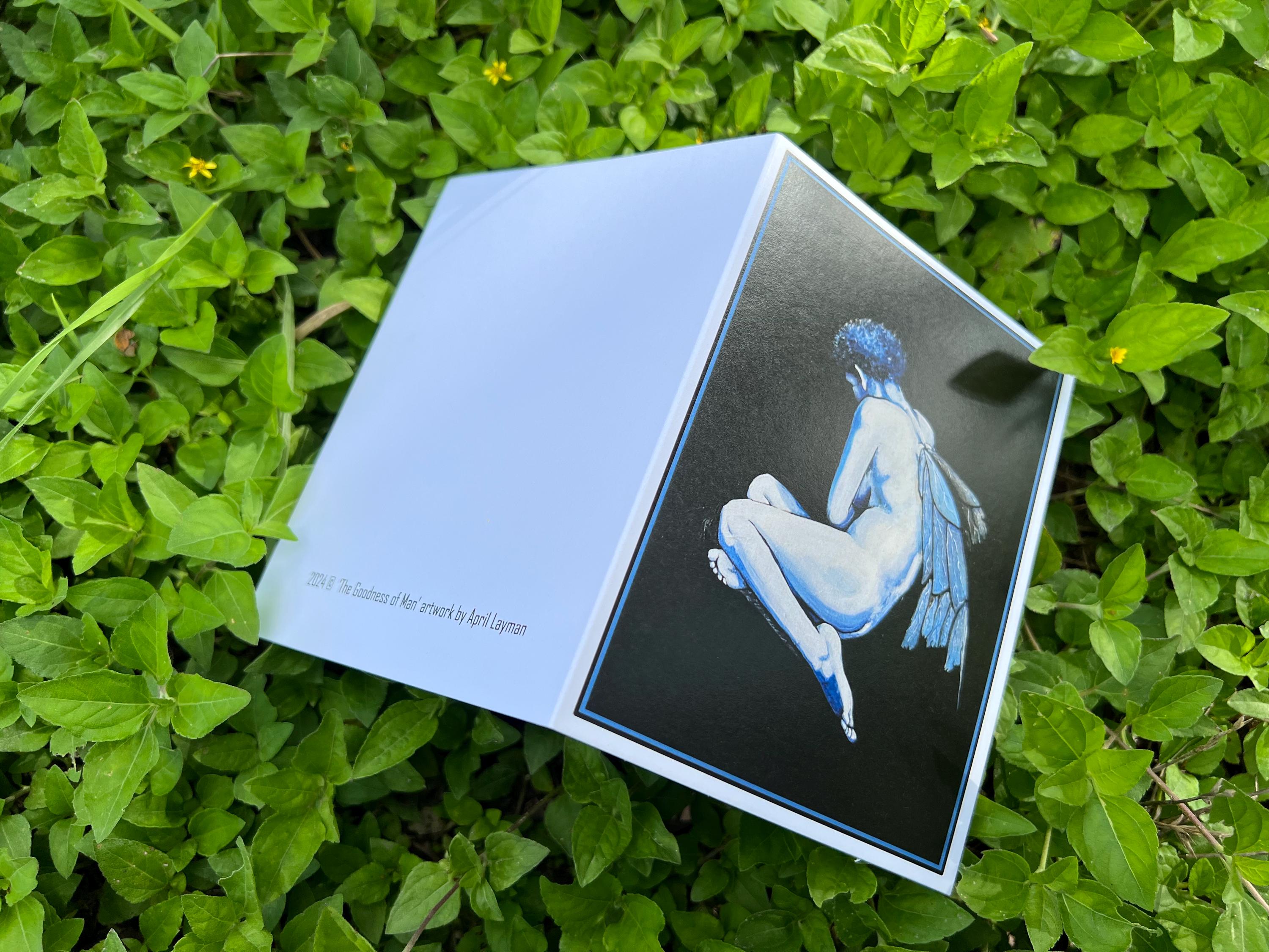 Blue fairy note card open on green background